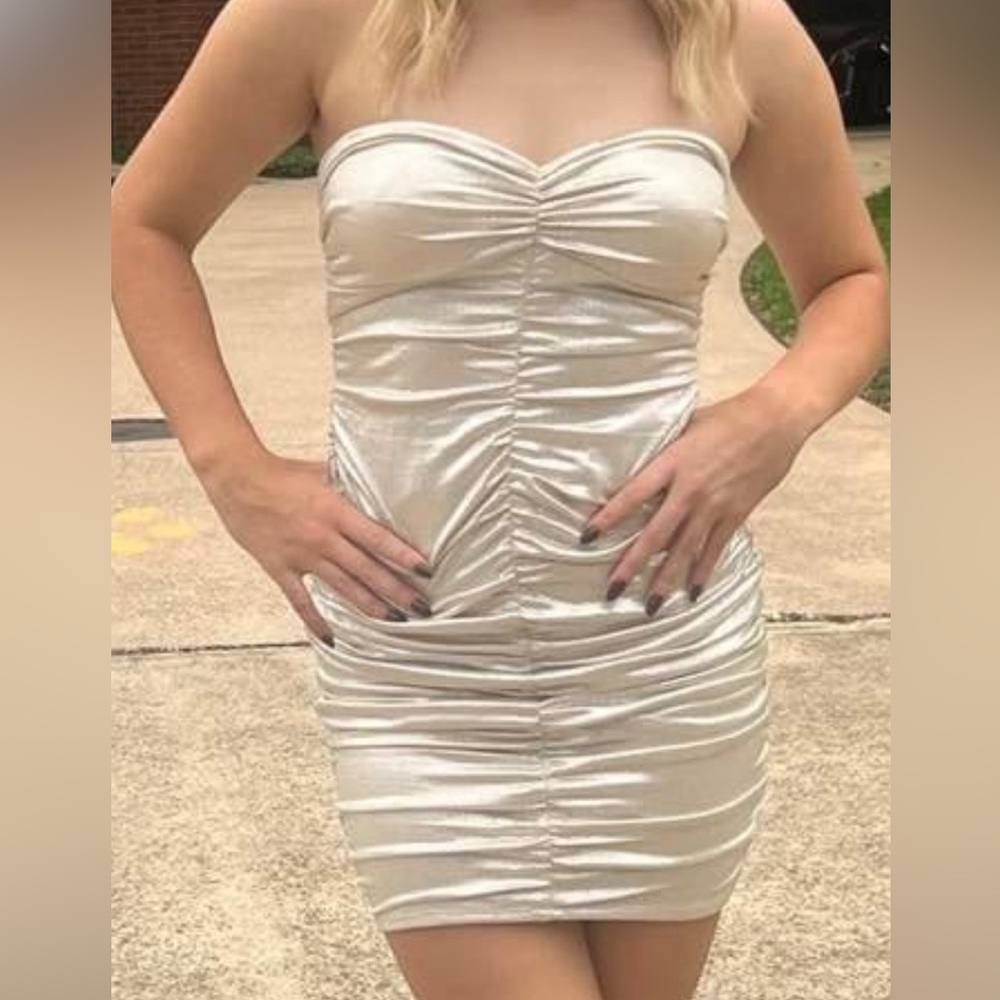 Mini, white gold/ silver dress. tight.